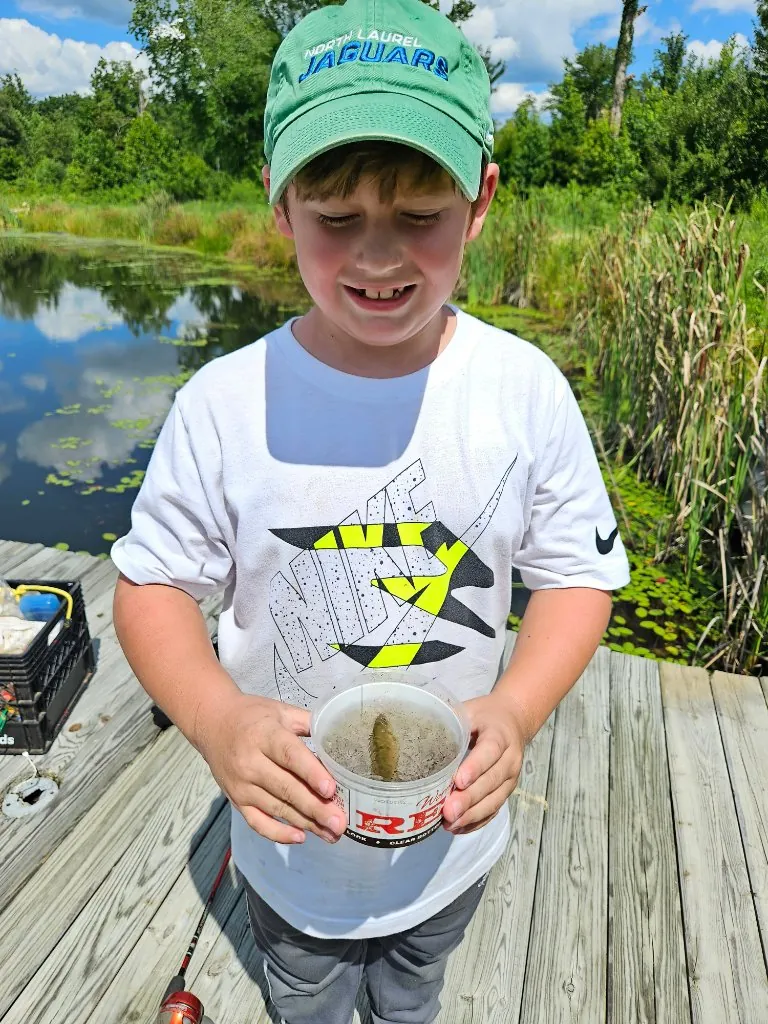 A child holding a fish