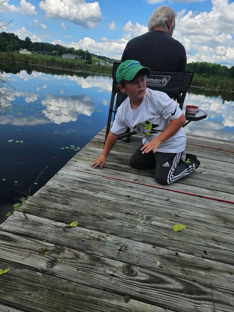 Fishing by a pond
