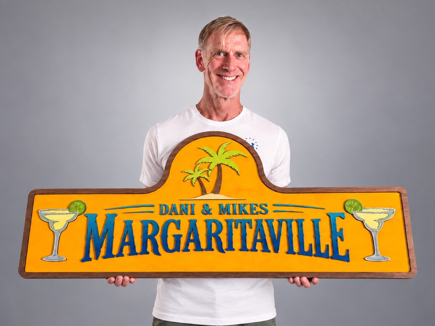 Mike holding a custom Margaritaville sign
