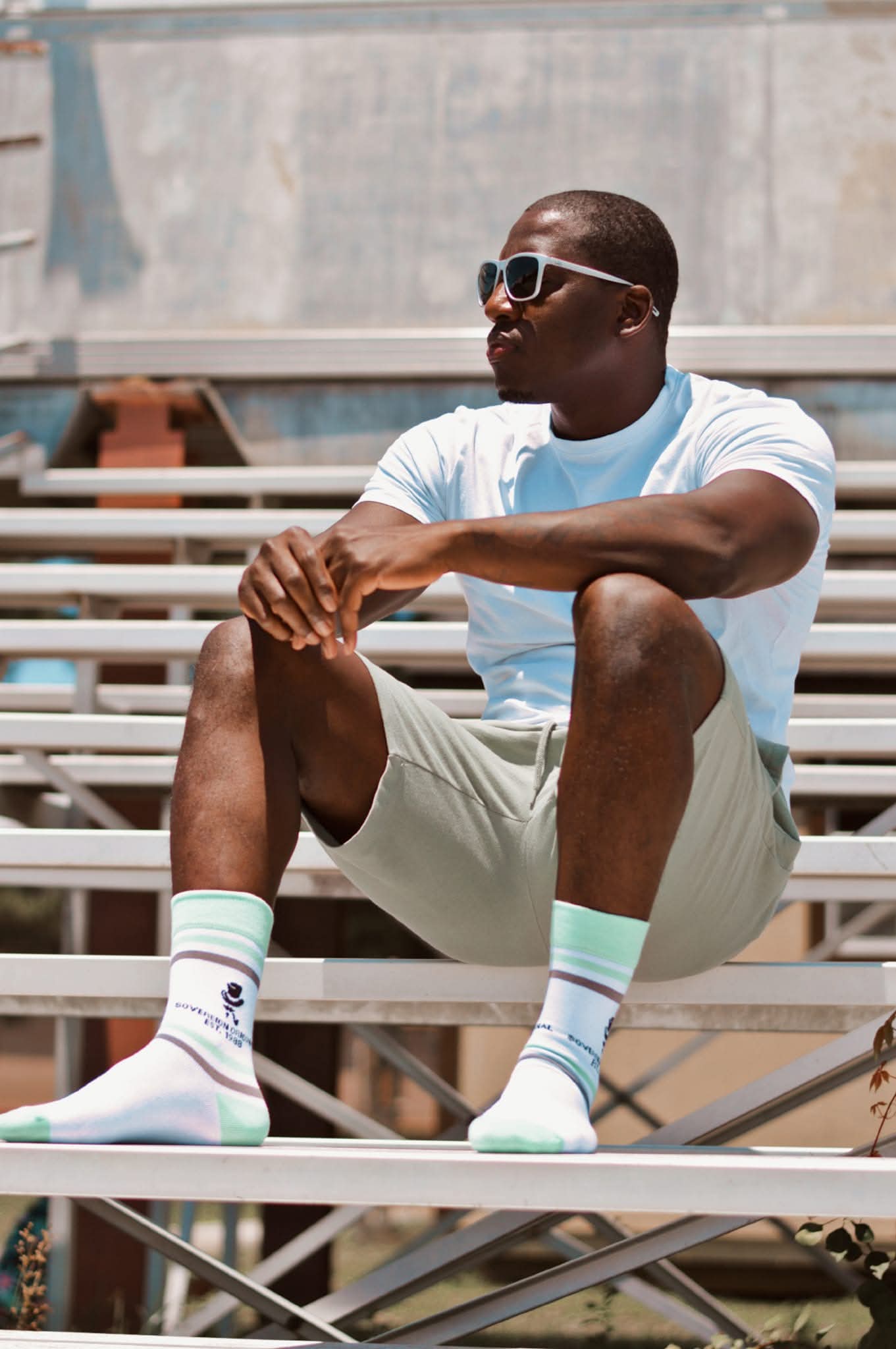 Orange-striped Sovereign Original crew socks styled with casual sneakers