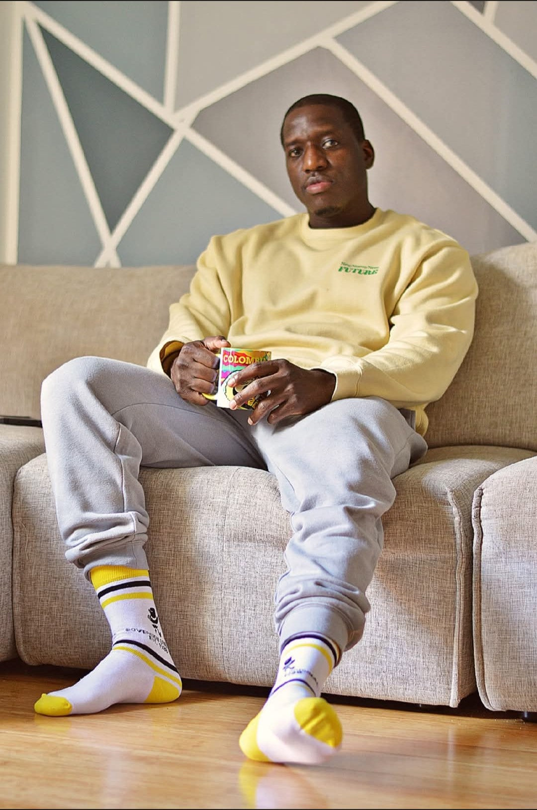 Sovereign Original yellow-striped crew socks worn with casual sneakers