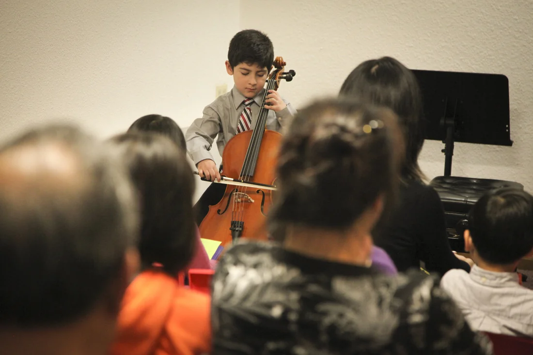 student performing confidently at an Amabile recital