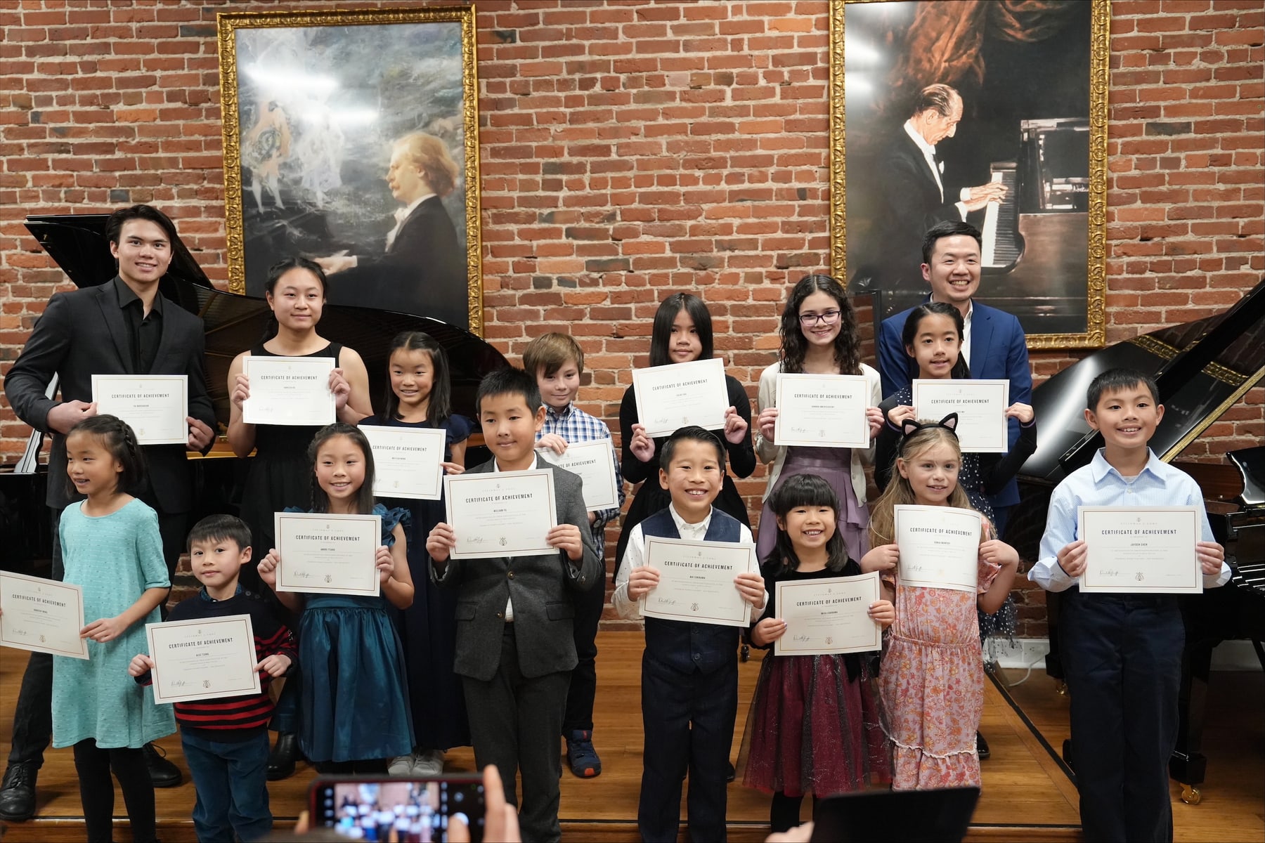 Students with recital certificates and teachers