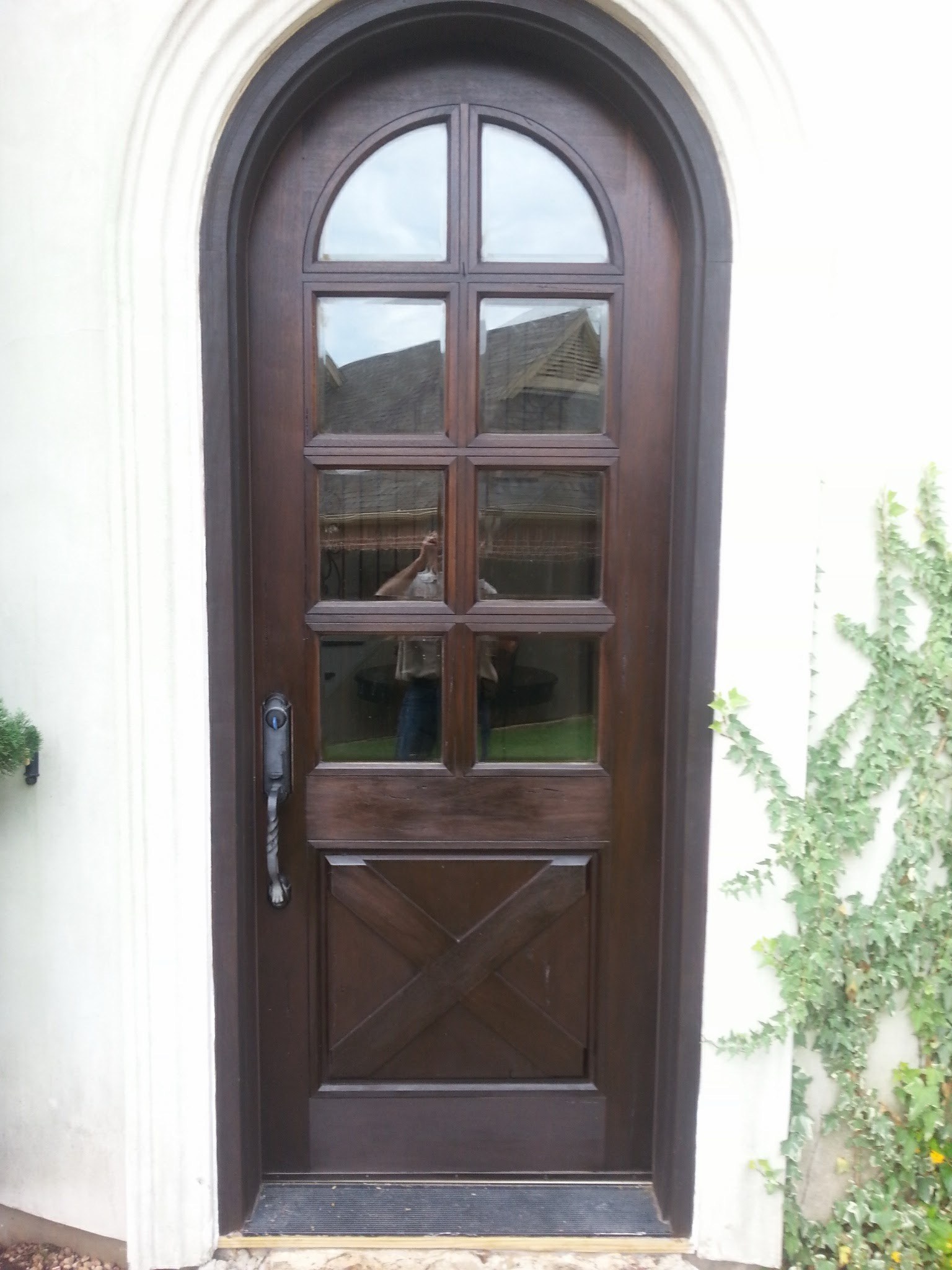 Tall arched glass entry door