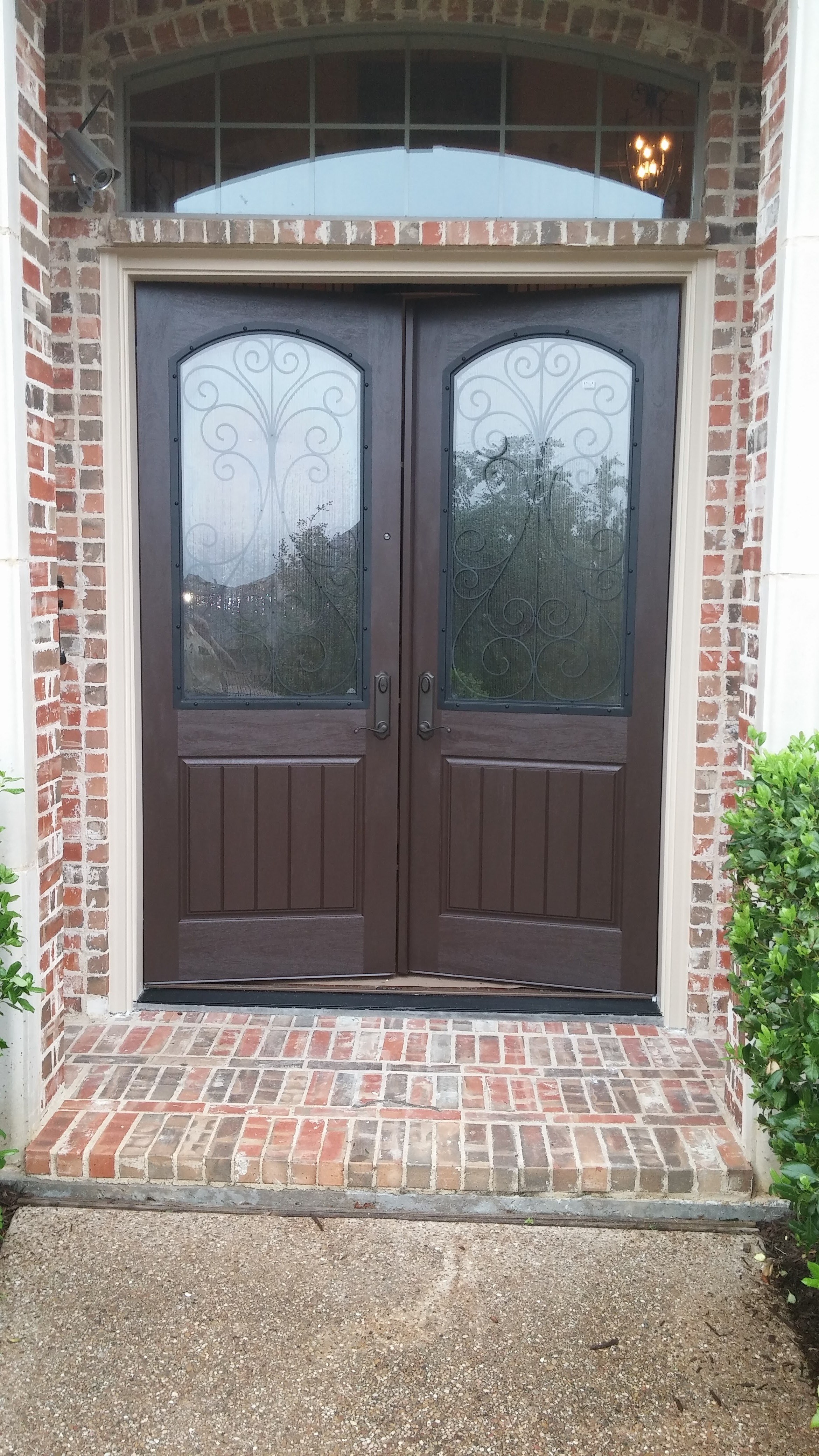 Finished entry door with an arched transom