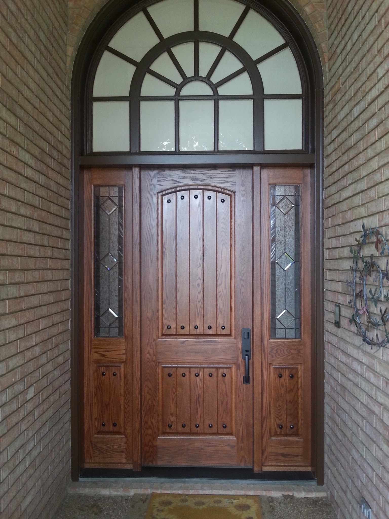 Wood double entry door with arched transom