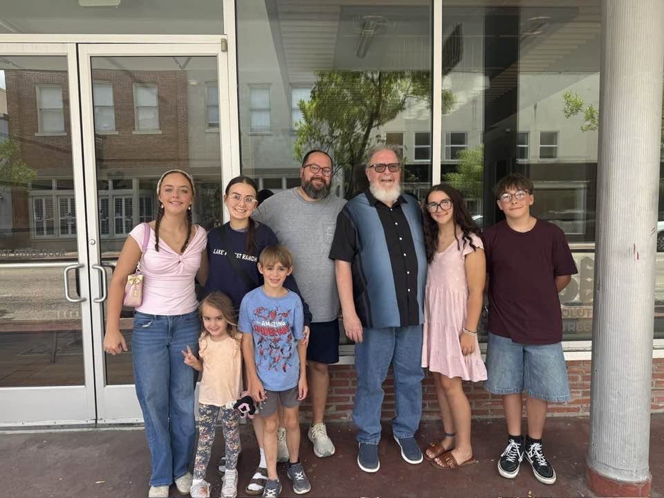 Family gathered together on a porch