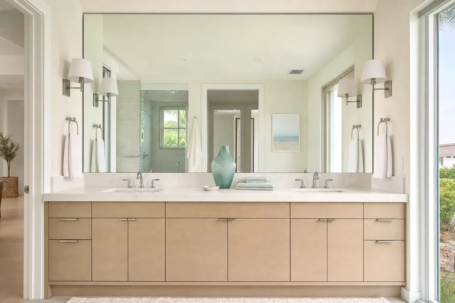 Large custom mirror above a vanity.