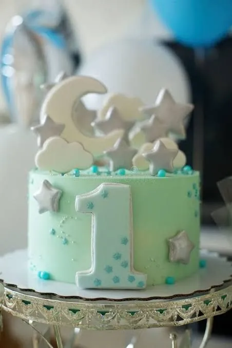 Blue and colourful cake with a matching smash cake