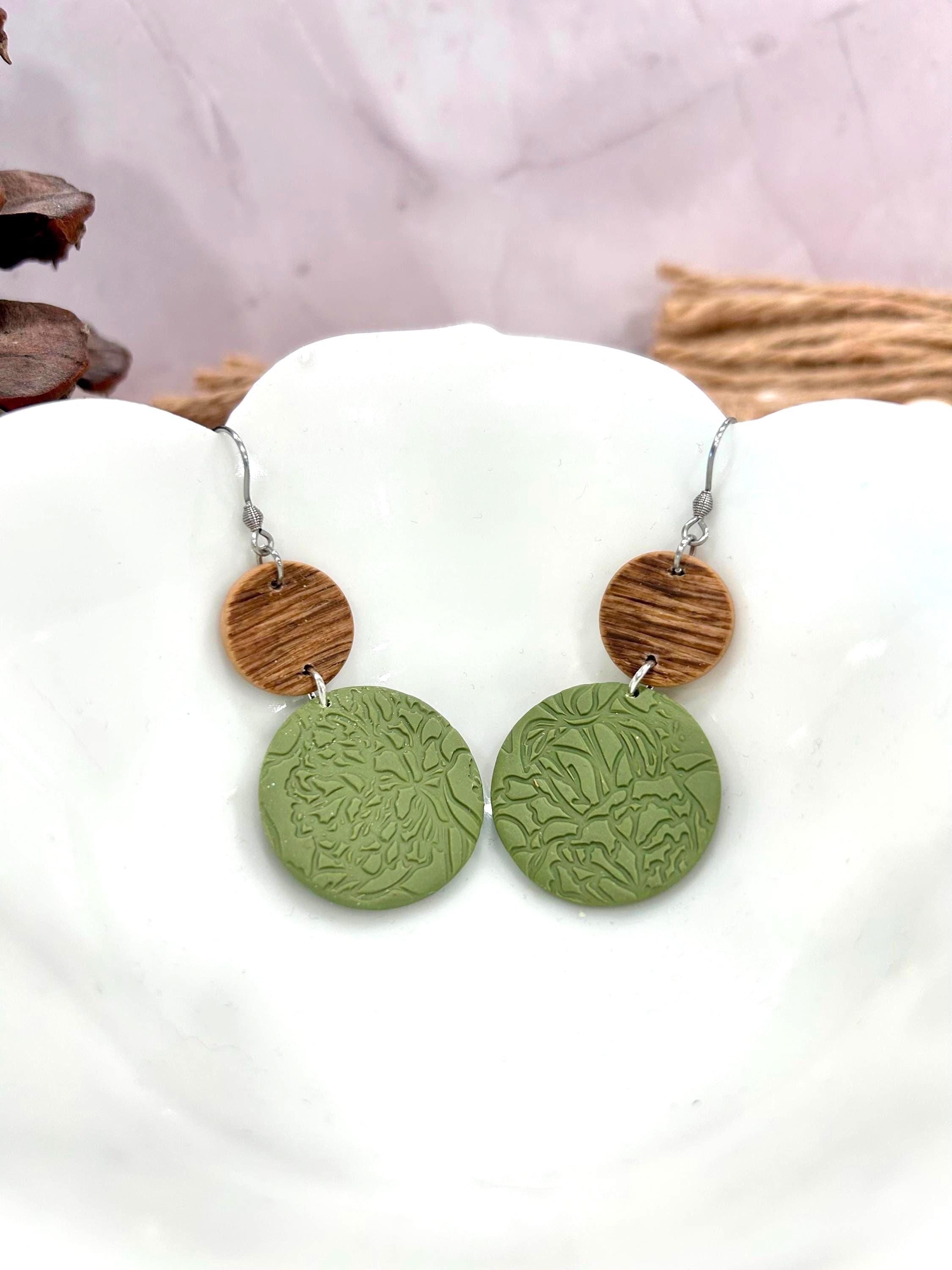 Olive green embossed polymer clay earrings with botanical texture