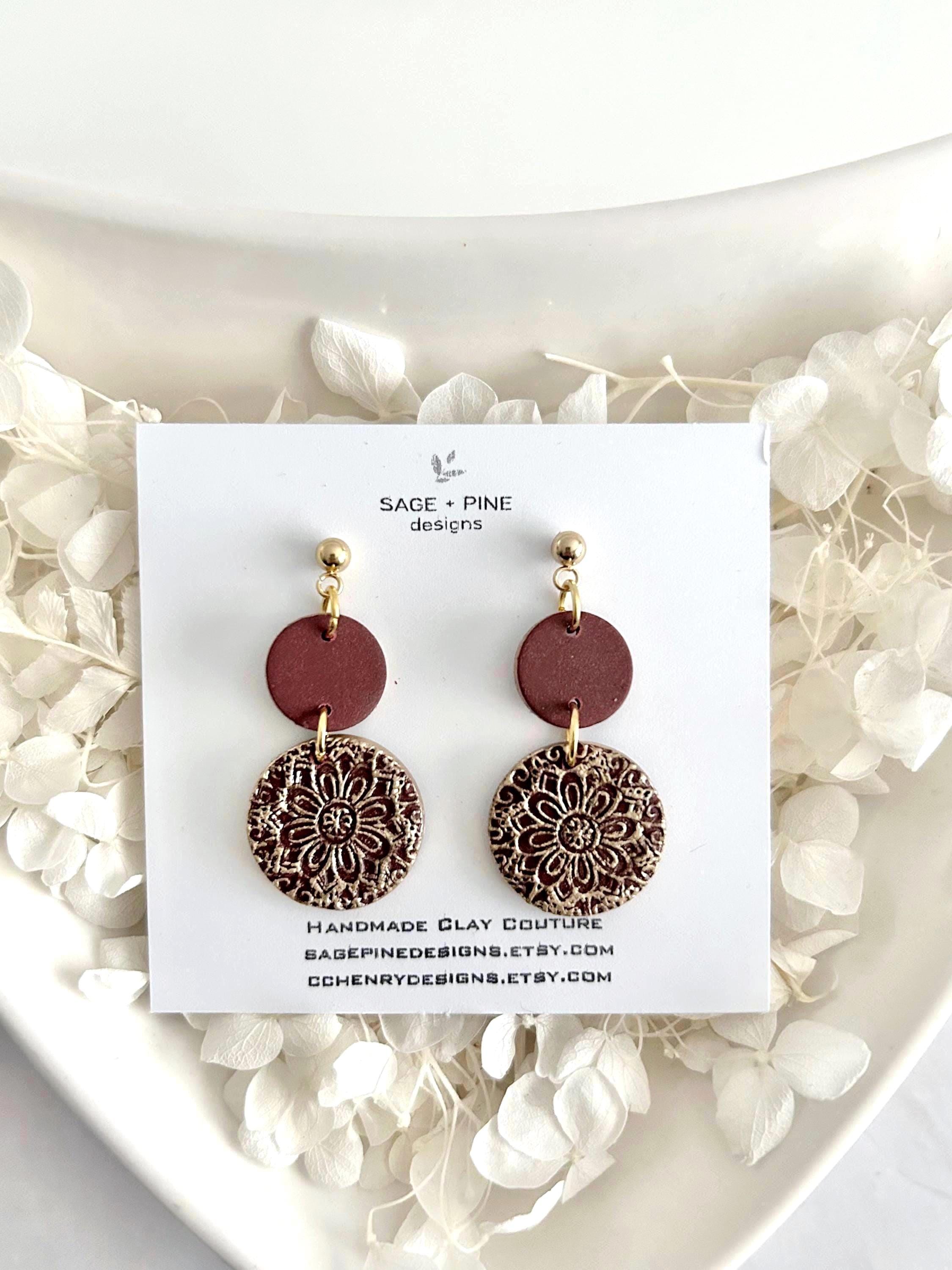 Burgundy mandala dangle earrings with gold detail