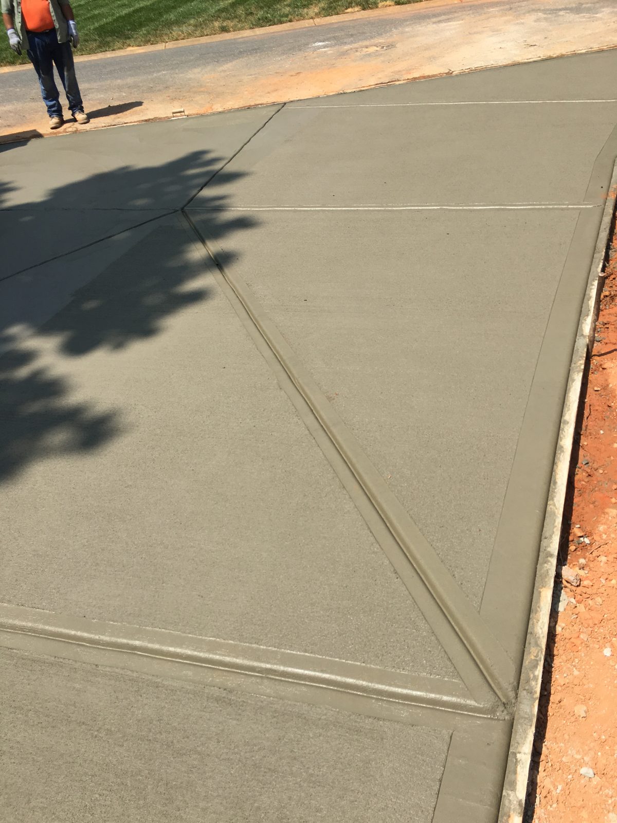 Angled control joint detail in a newly finished driveway