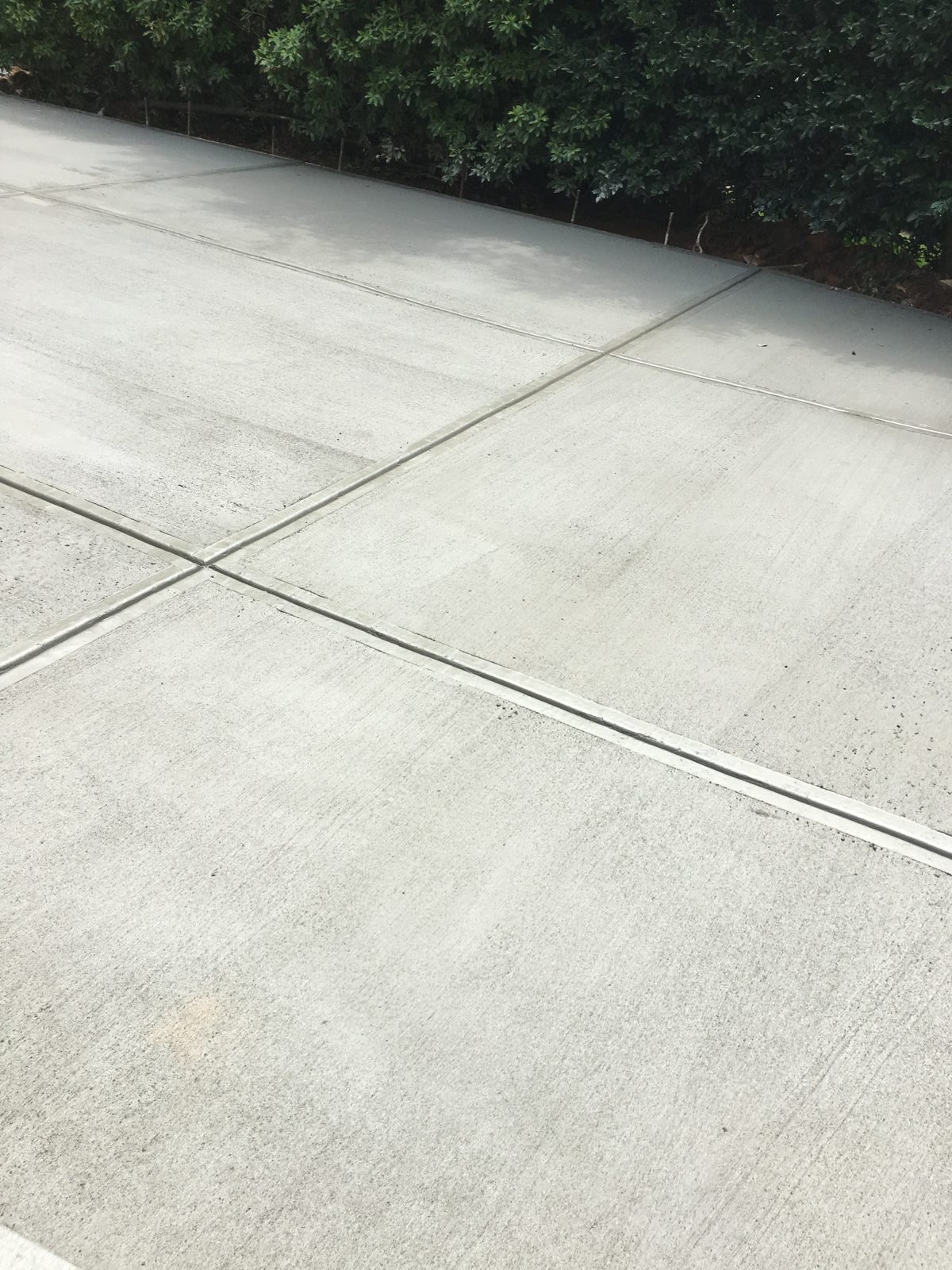 Intersecting joints in a finished concrete driveway