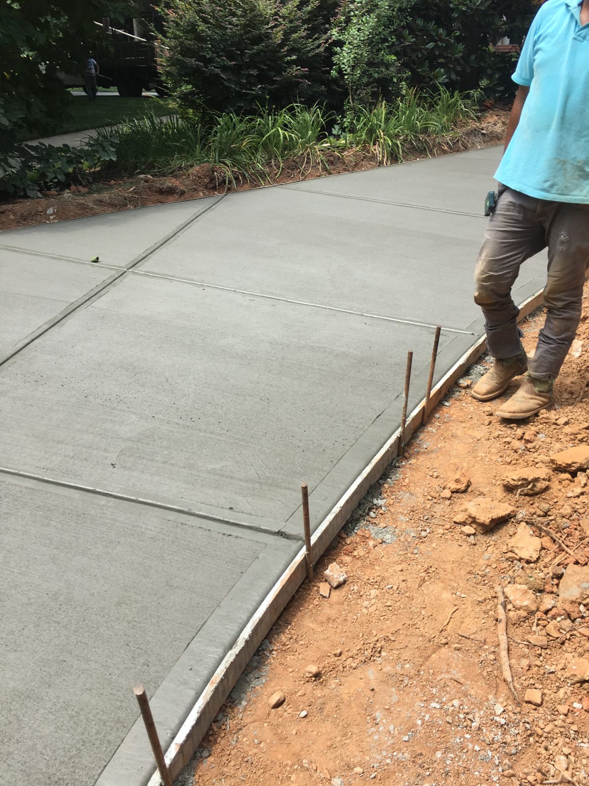 New driveway following a curved border beside a hedge