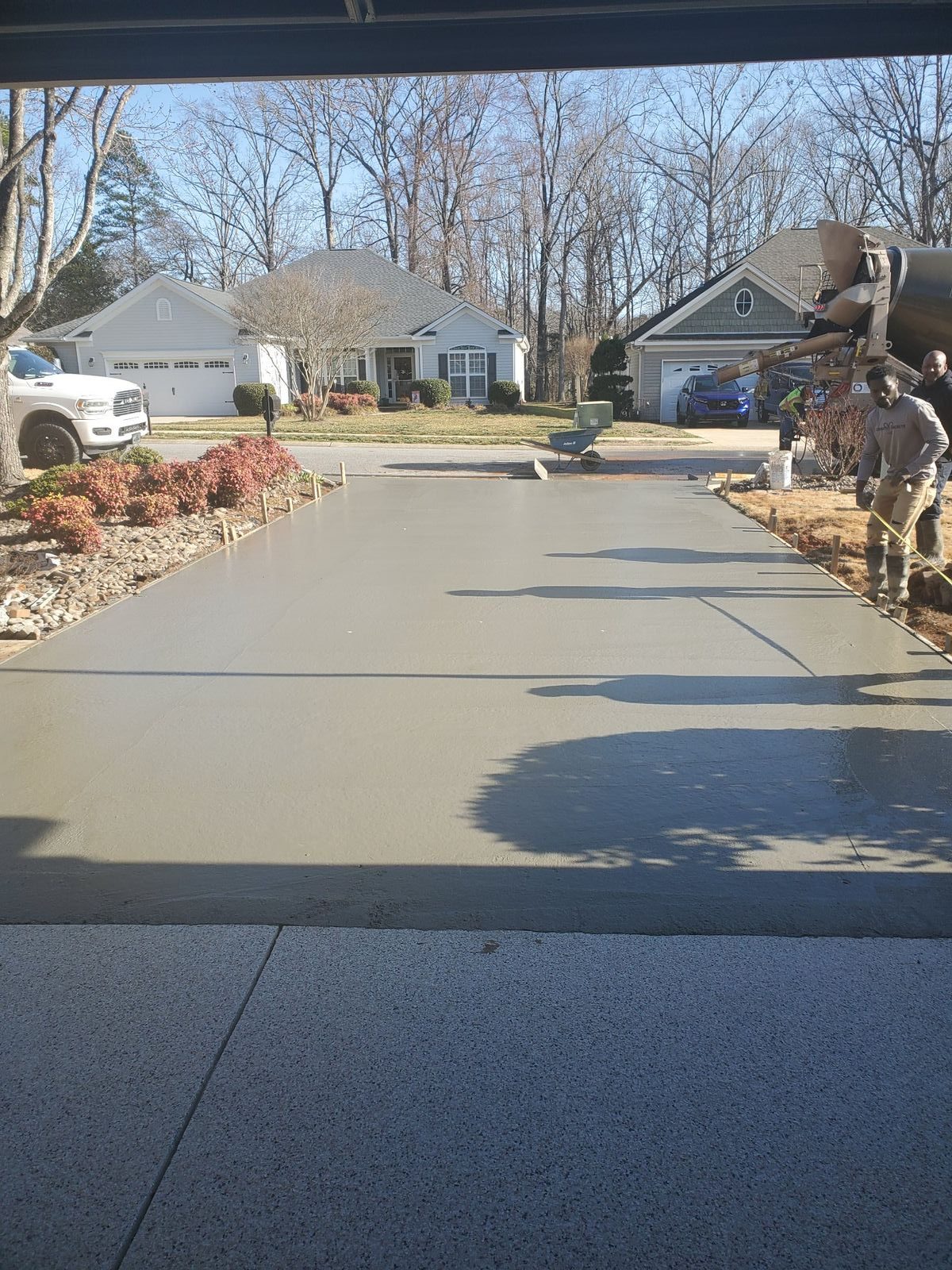 New concrete driveway outside a home