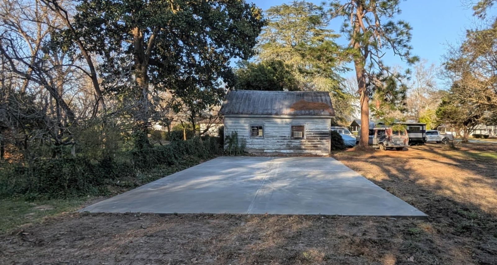 Completed concrete slab leading to a detached garage