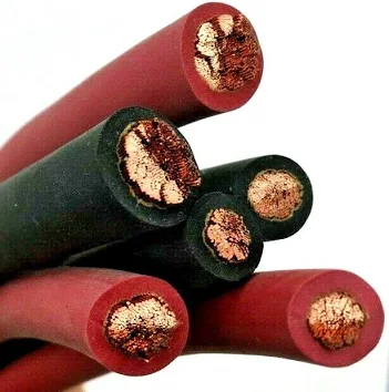 Flexible red and black welding cable with exposed copper conductors