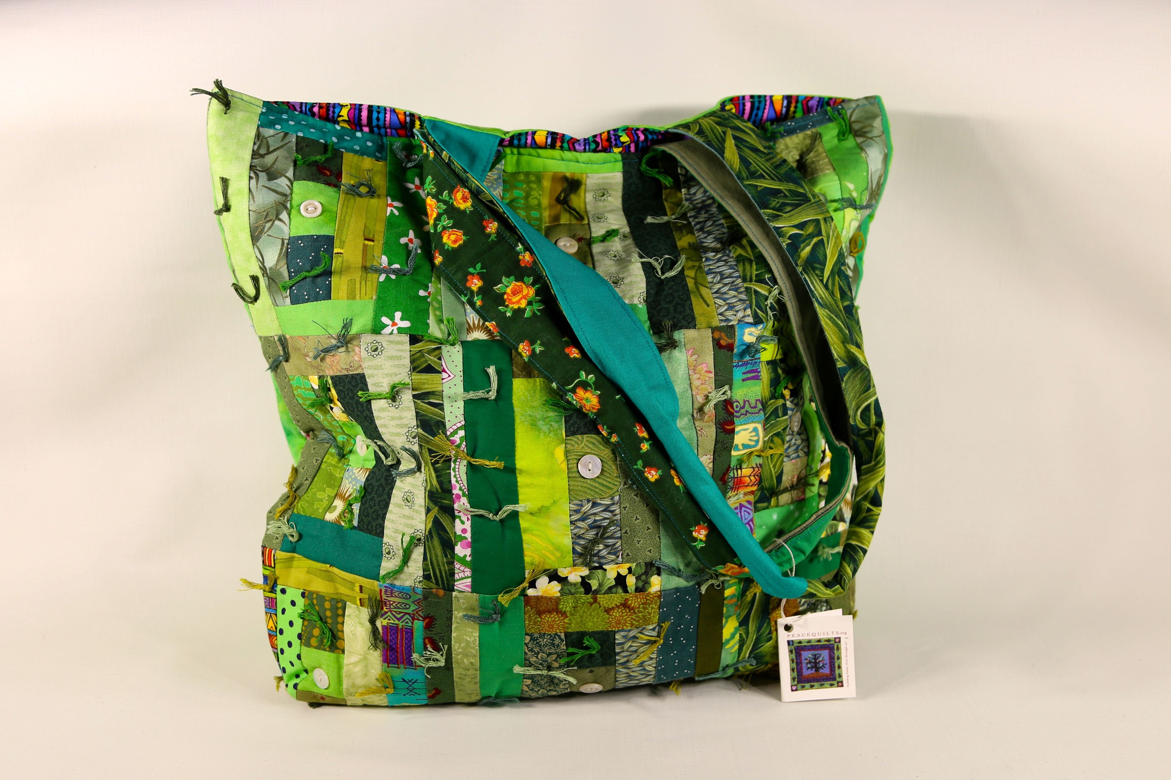 Colorful handmade quilted tote bag with stitched patchwork