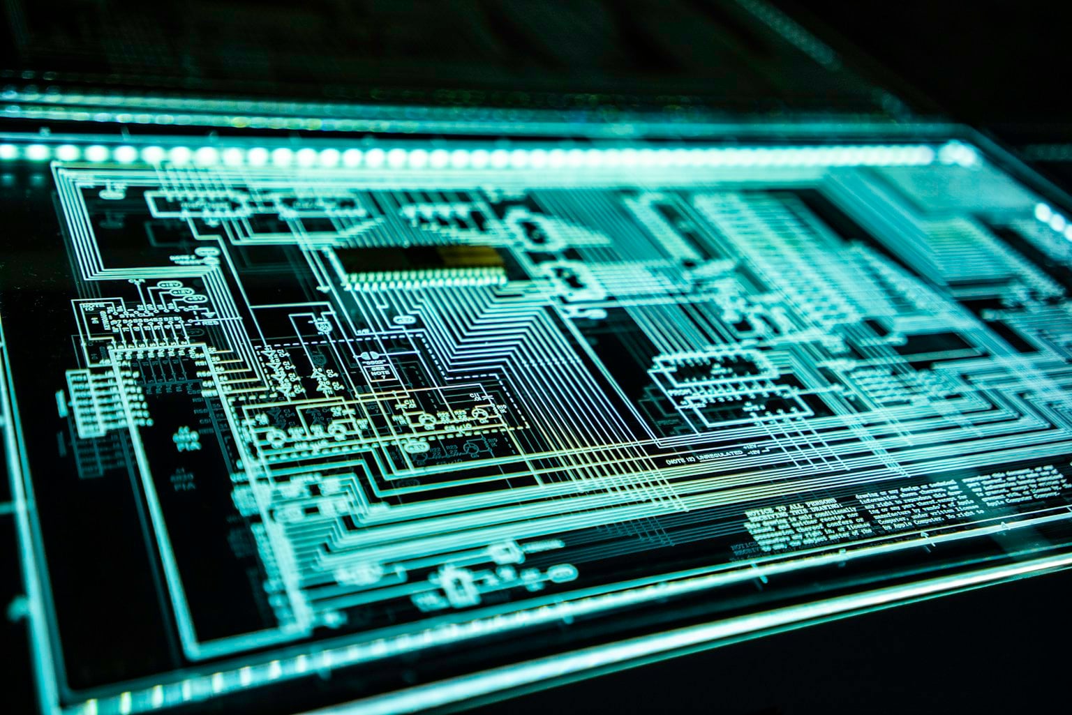 Detailed electronic circuit board representing the dependencies behind critical technology services