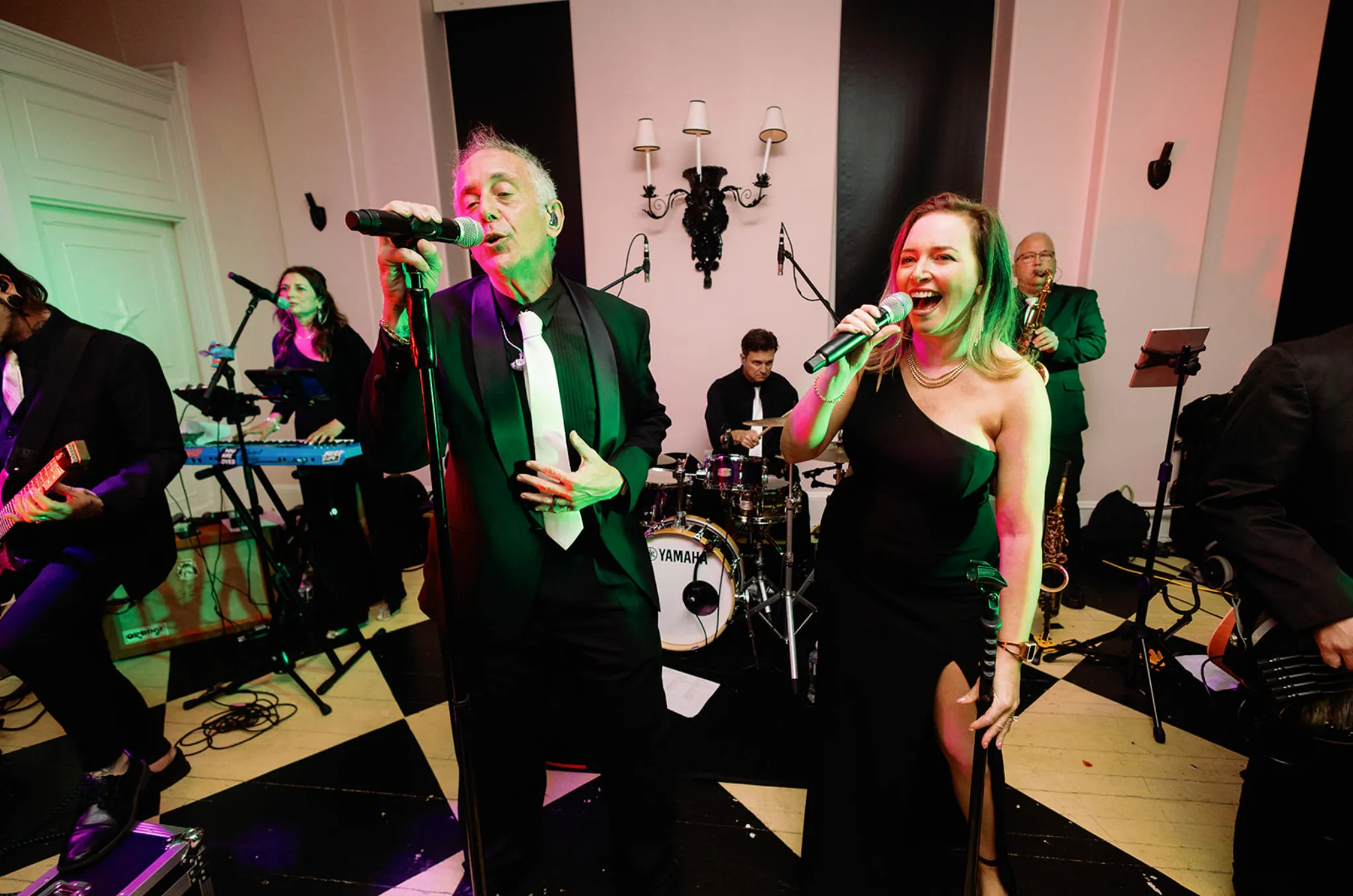Bigg Romeo vocalists and musicians performing together at a wedding
