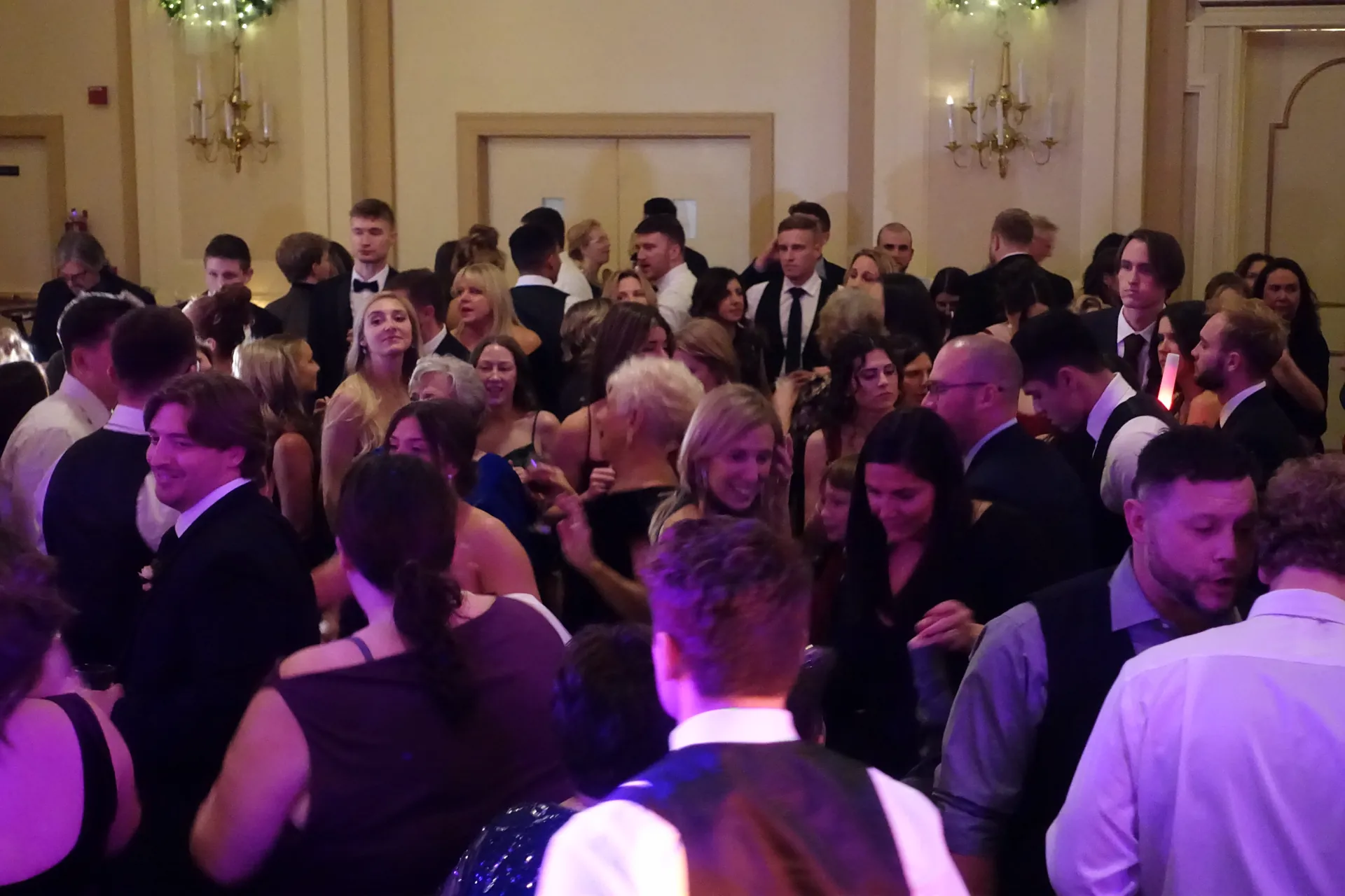 A packed dance floor at a Bigg Romeo wedding reception