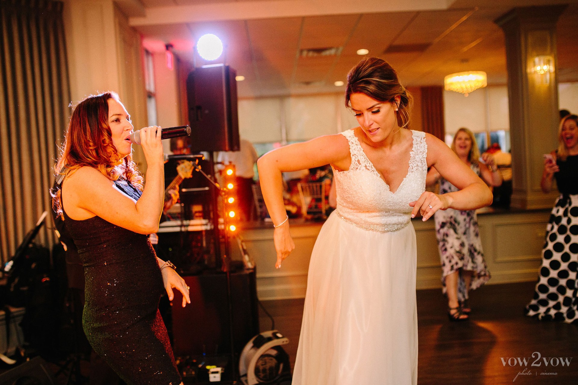 Bigg Romeo vocalist performing alongside a bride at a wedding reception