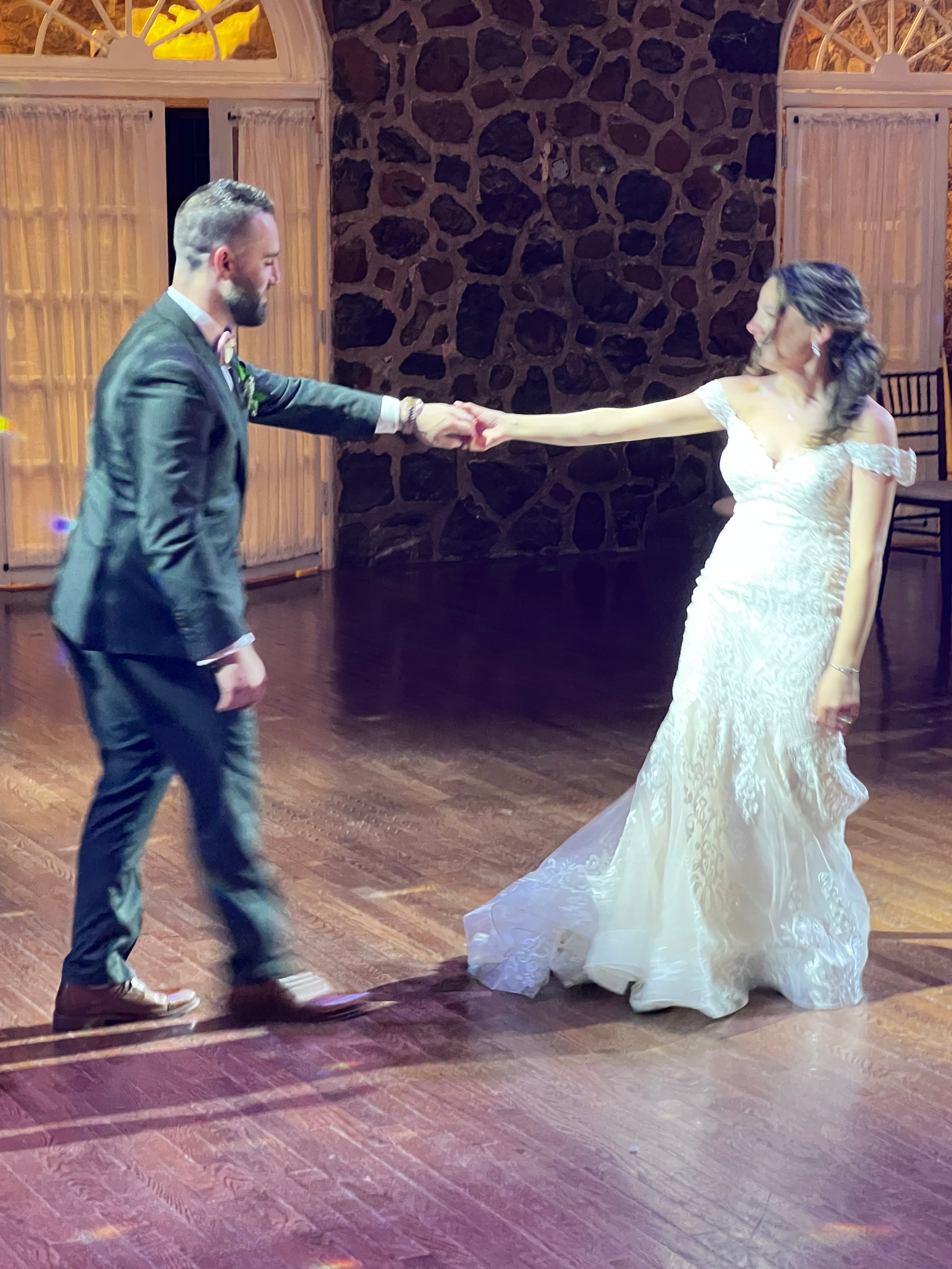 Newlyweds dancing together at their reception
