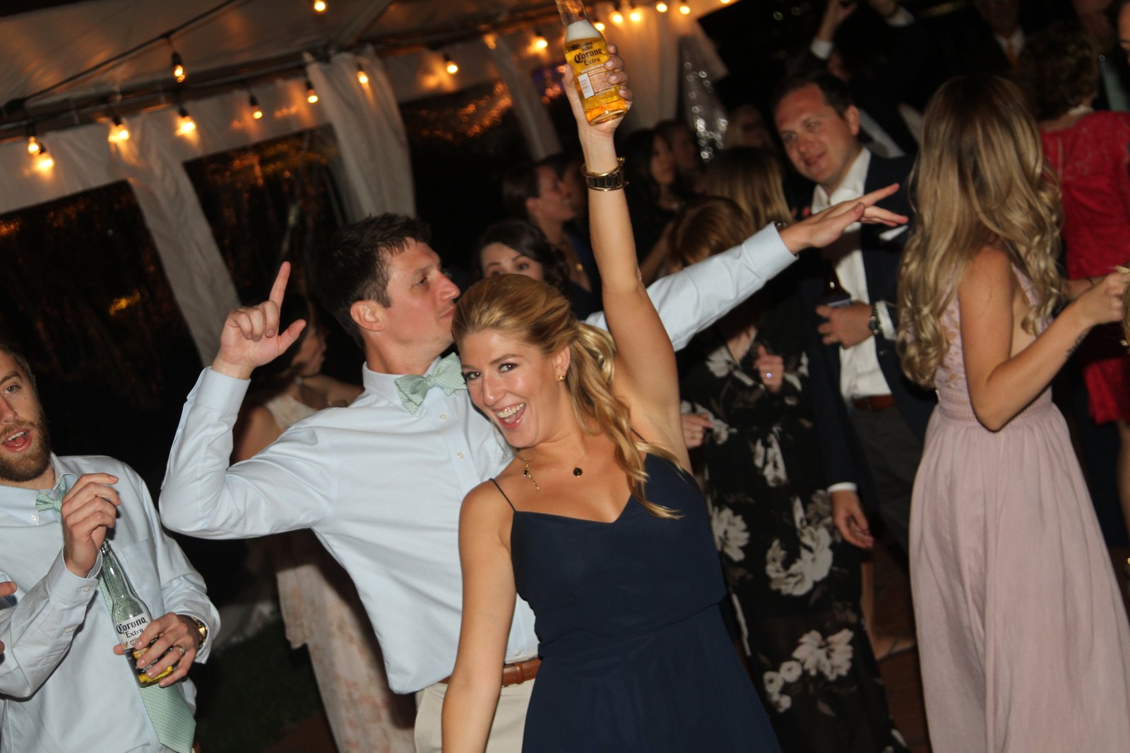 Wedding guests celebrating together on the dance floor