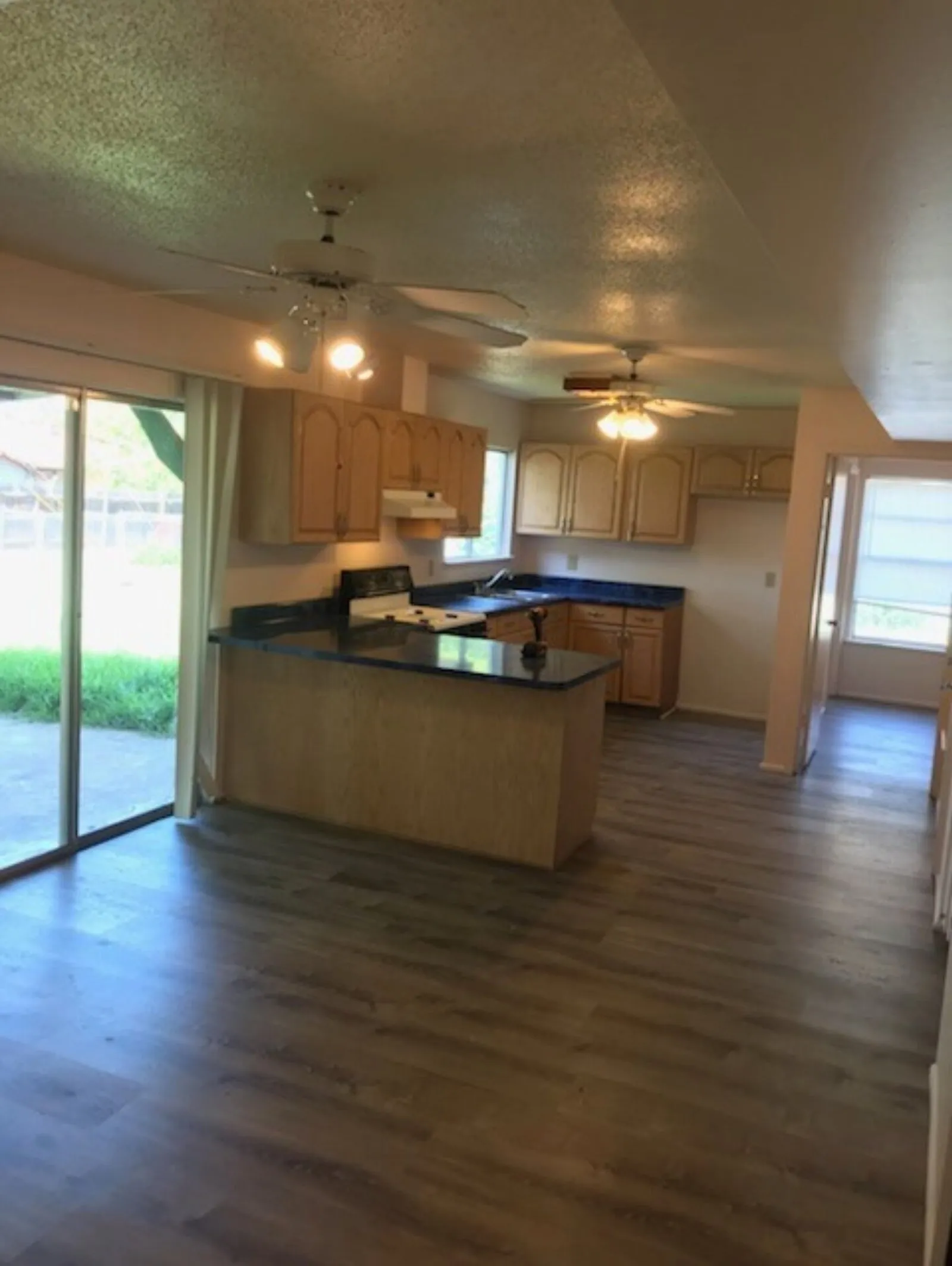 Finished apartment flooring and kitchen area