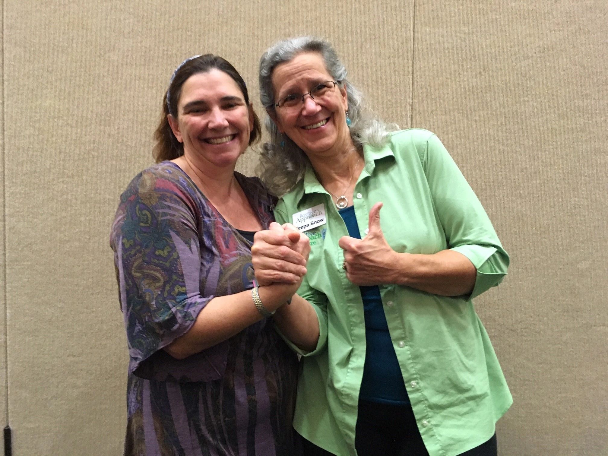Judi Cleary and Teepa Snow demonstrating a Positive Approach to Care technique