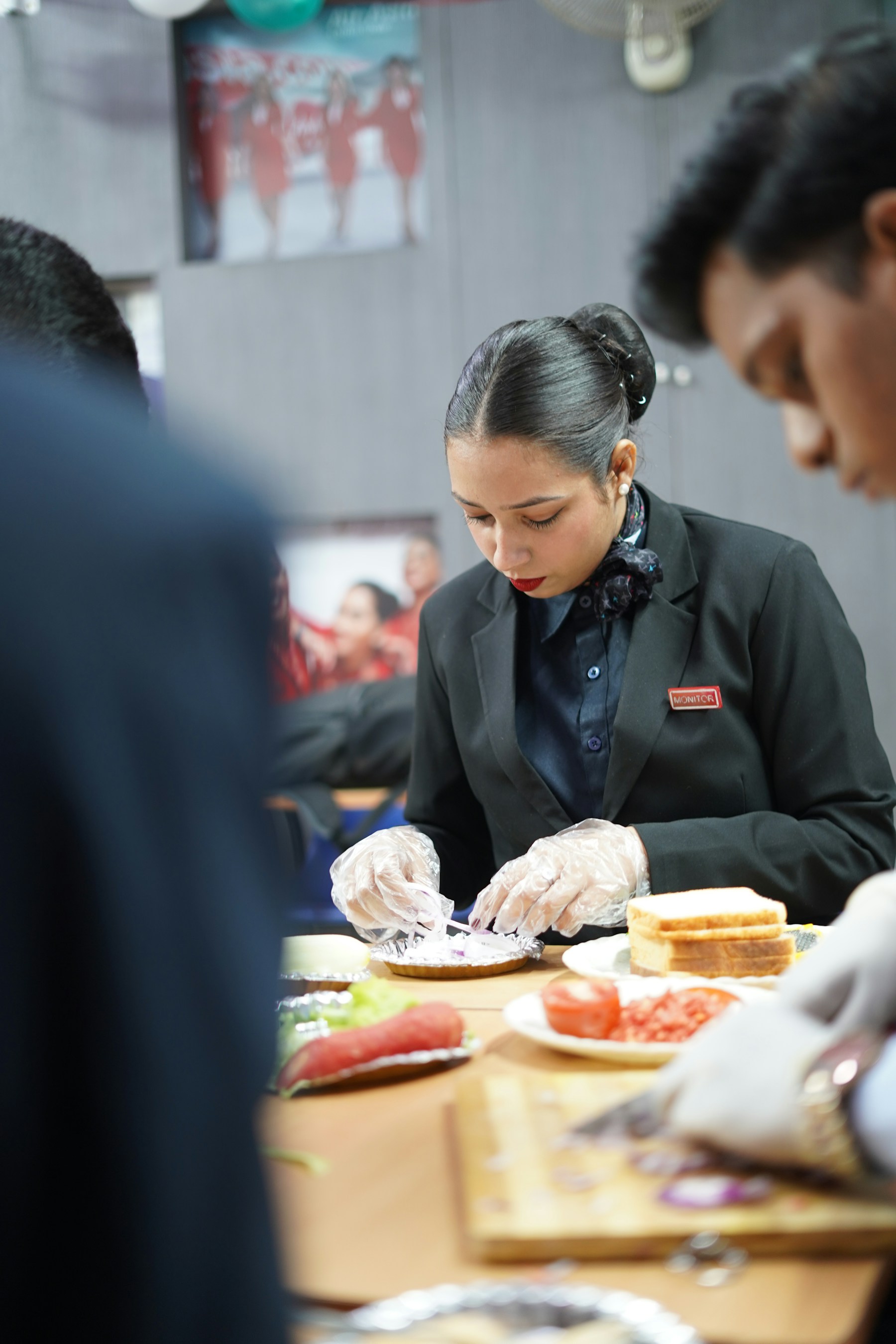 Catering team preparing food in a commercial kitchen