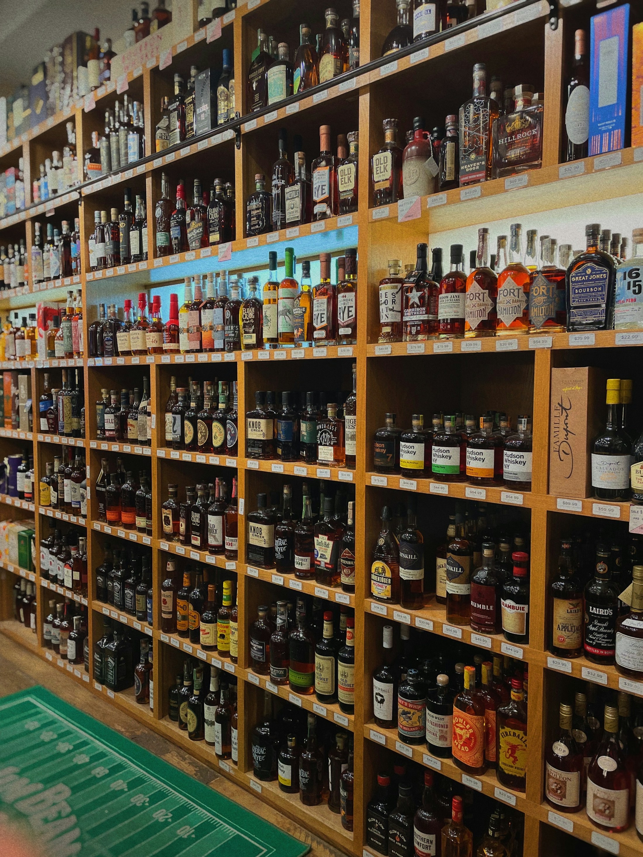 Shelves of spirits inside a liquor store
