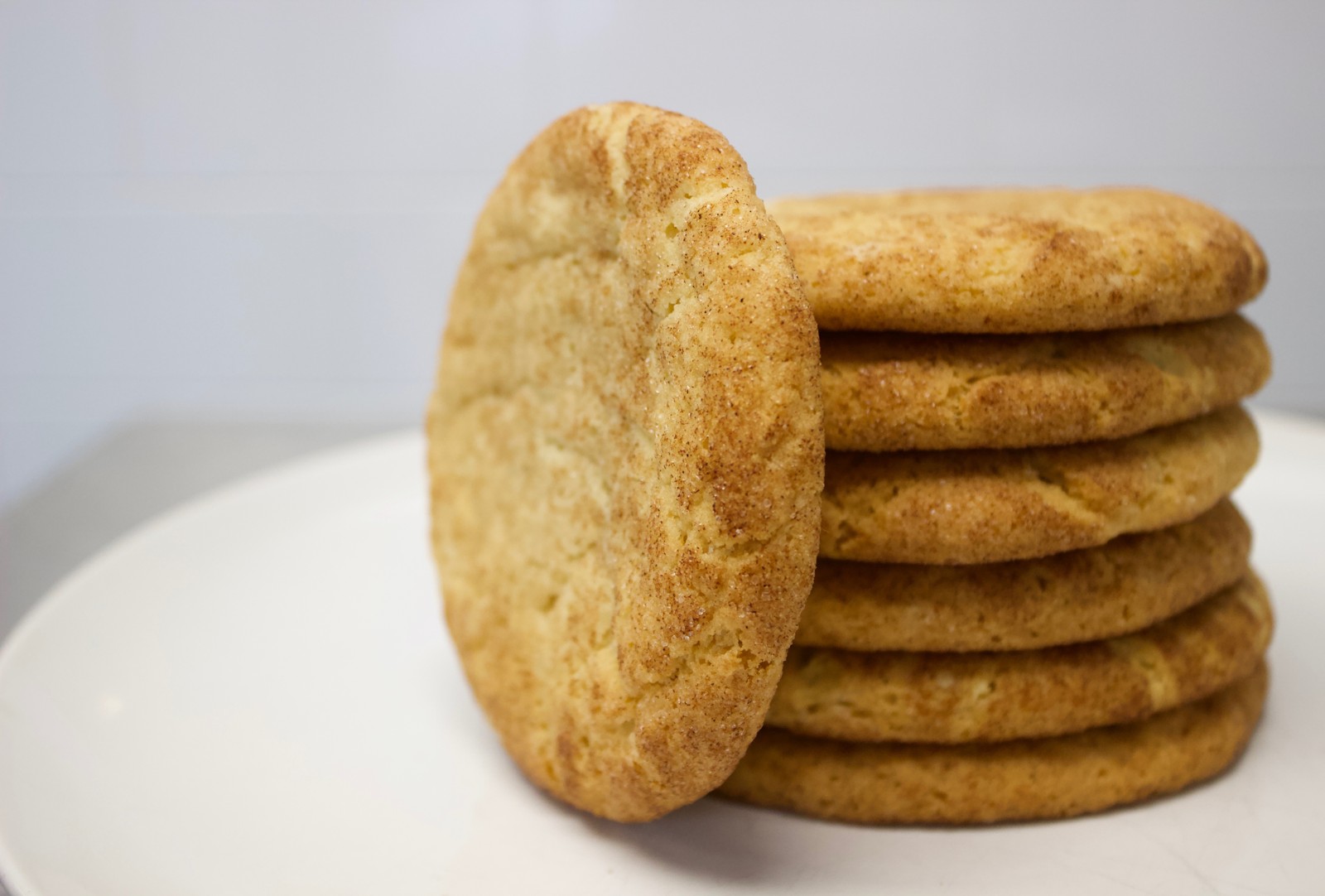 Snickerdoodle cookies stacked on a plate