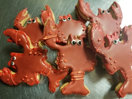 Decorated red crawfish-shaped cookies