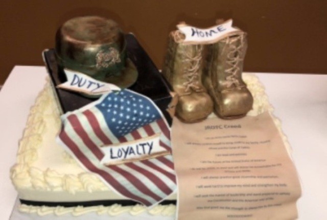 Custom NJROTC cake with boots, a camouflage hat and an American flag