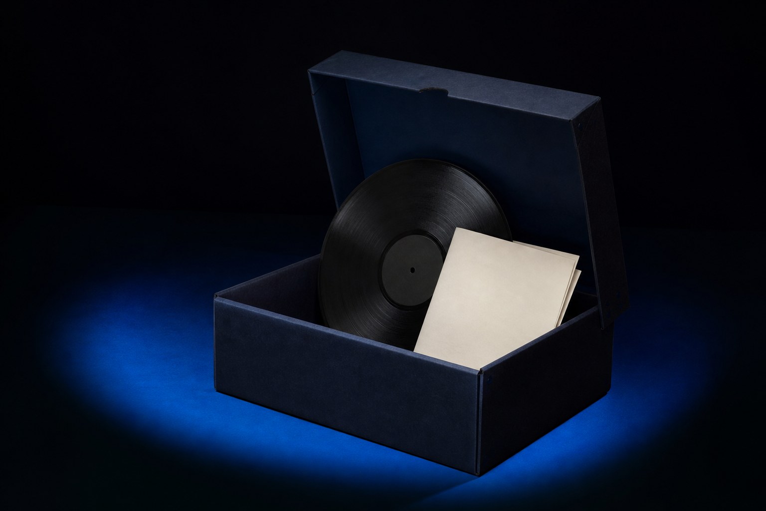 A protective archival box holding a vinyl record and folded blank paper on a dark blue surface