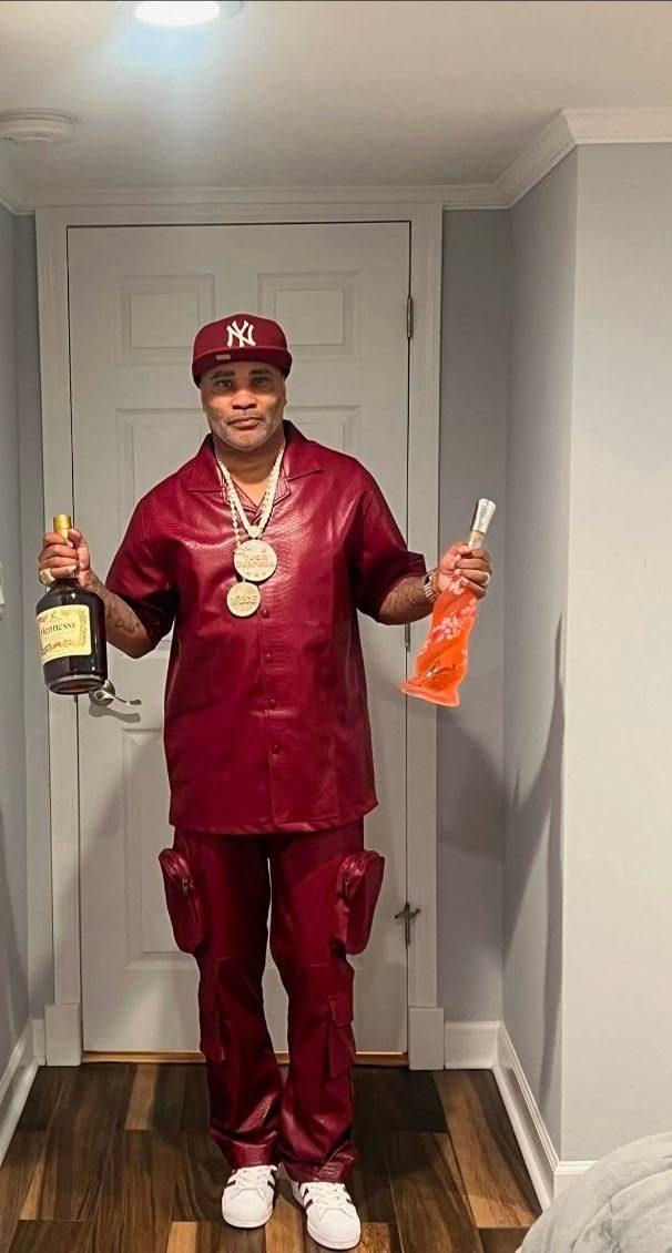 Lawrence McGriff in a burgundy suit