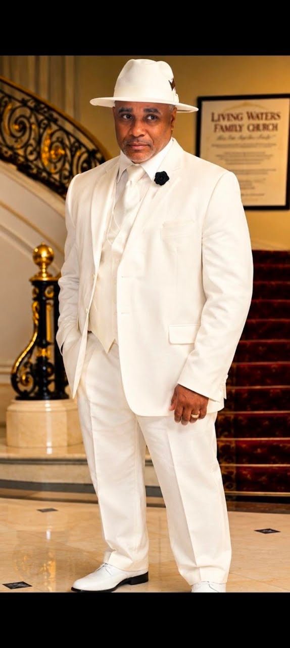 Lawrence McGriff in a white suit and hat