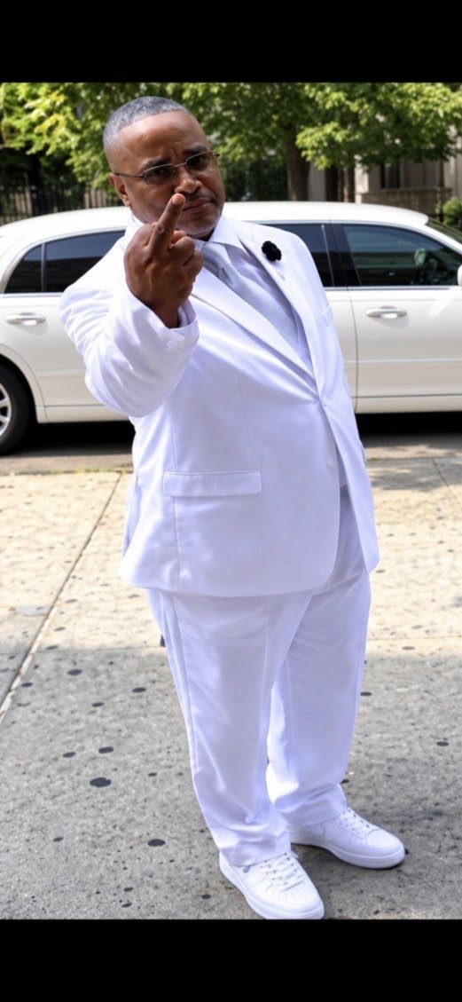 Lawrence McGriff standing outdoors in white clothing