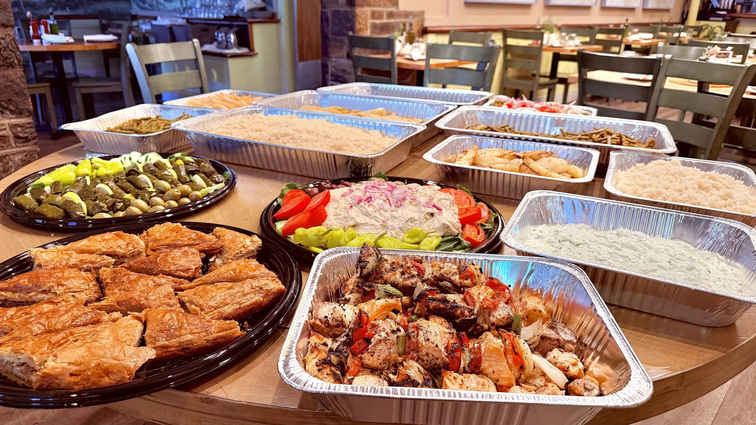 Greek dishes set out for a shared meal