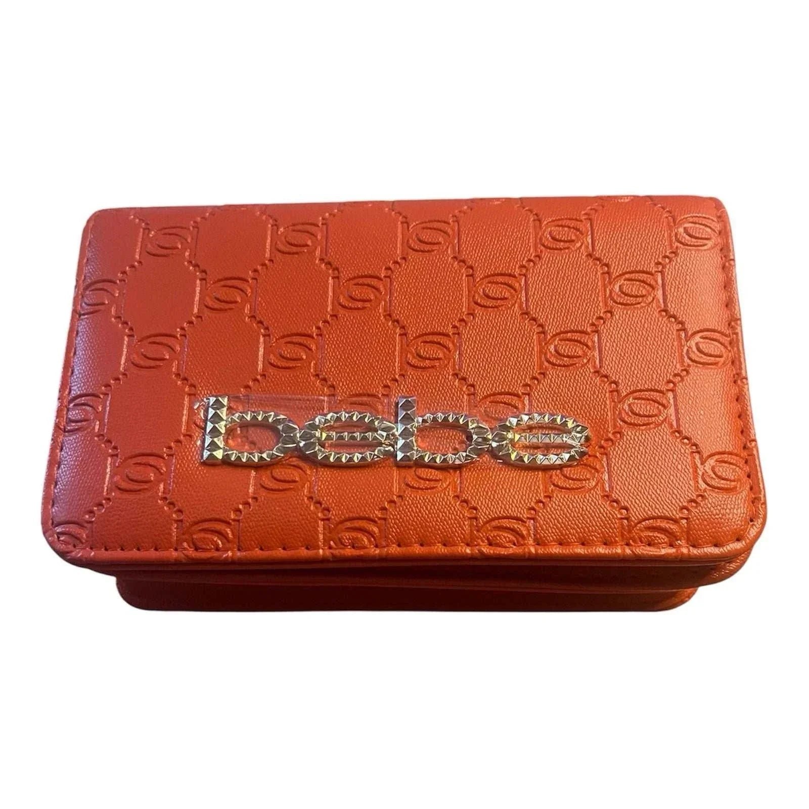 A coral Bebe handbag from Primrose Signature Boutique