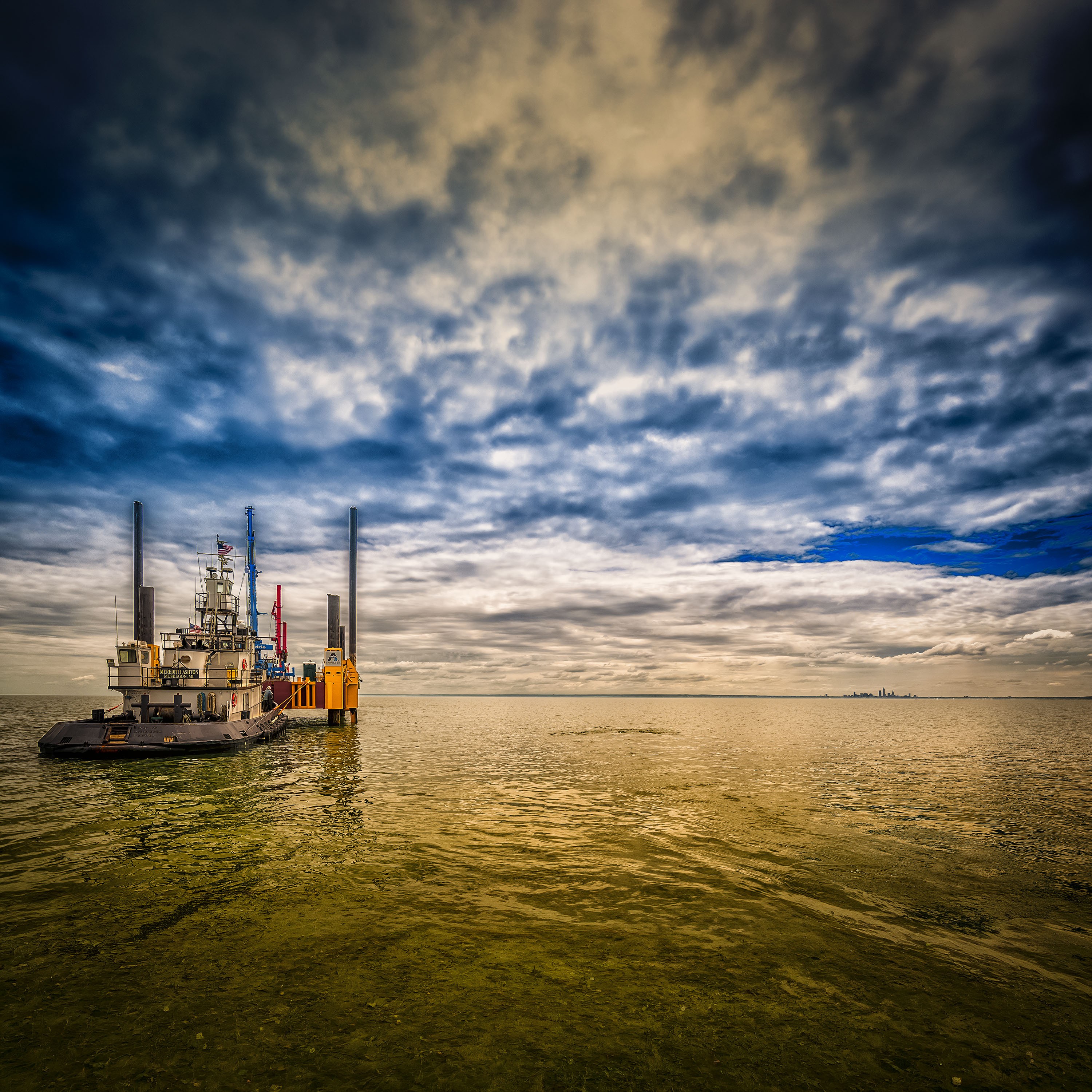 Tugboat on Lake Erie beneath a dramatic sky