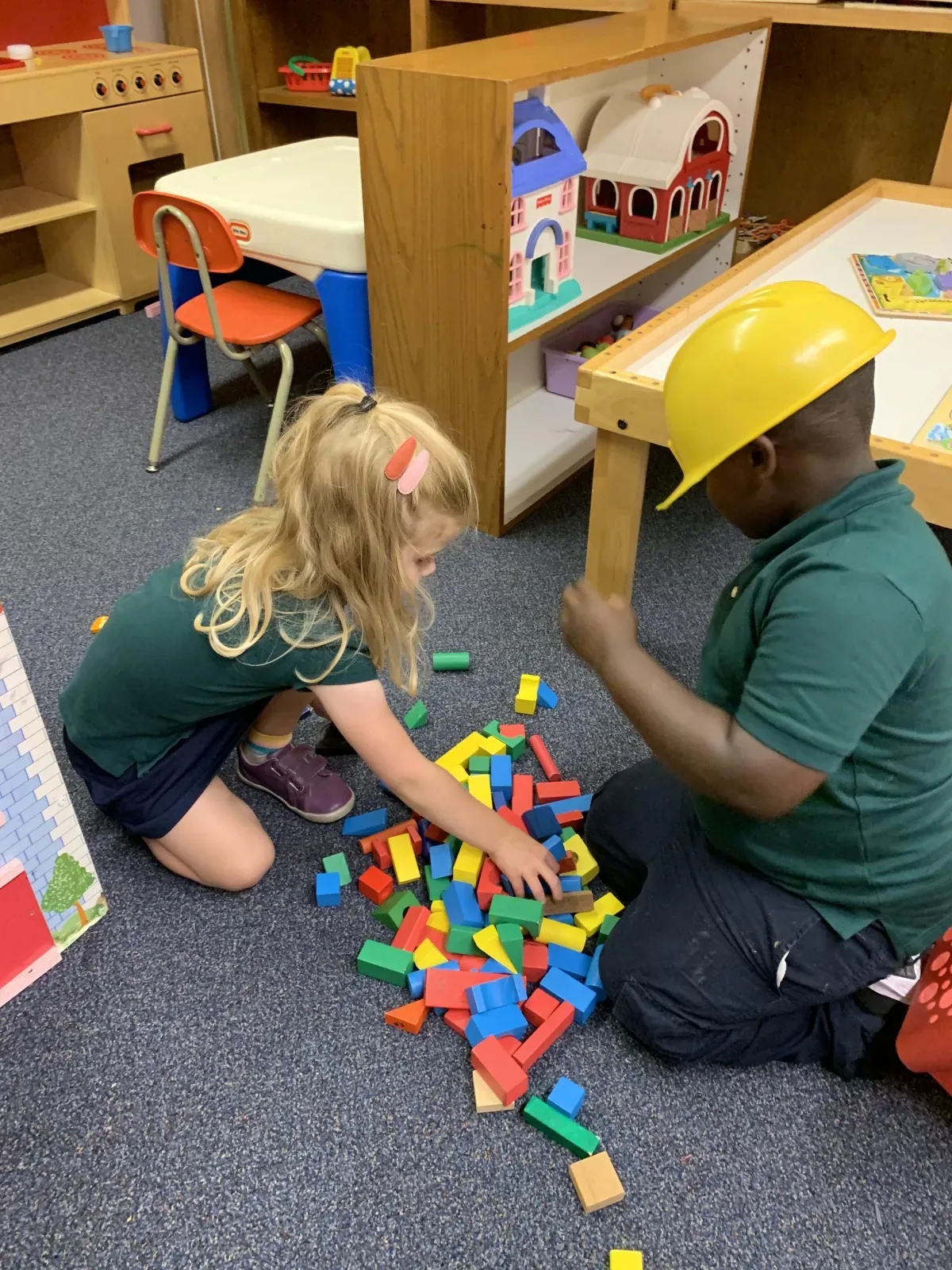 Children exploring hands-on classroom learning centers
