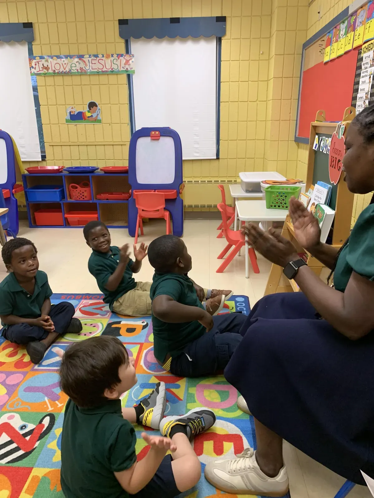Teacher guiding children in a small learning group