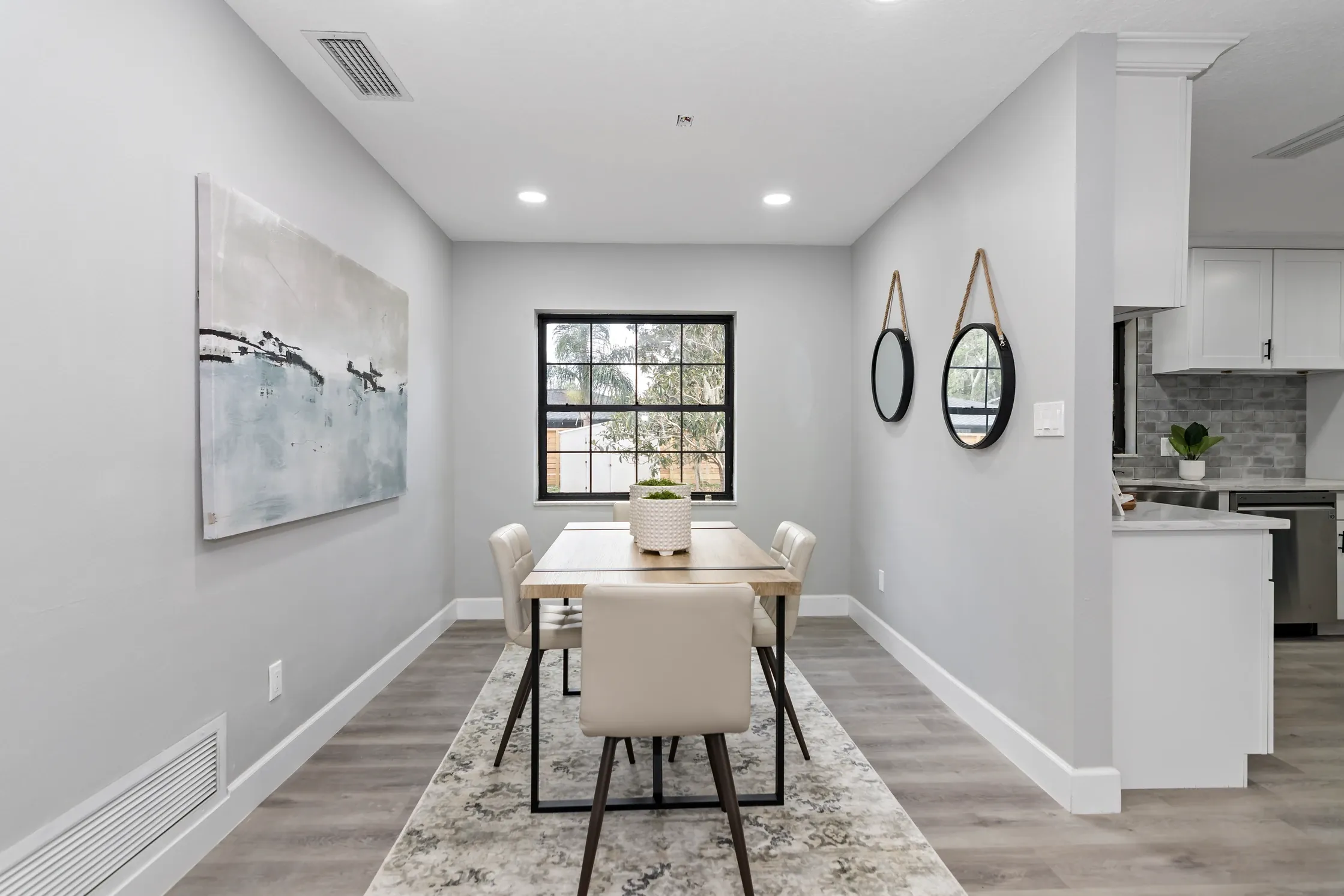 Staged living room showing an open conversation area and clear walkway