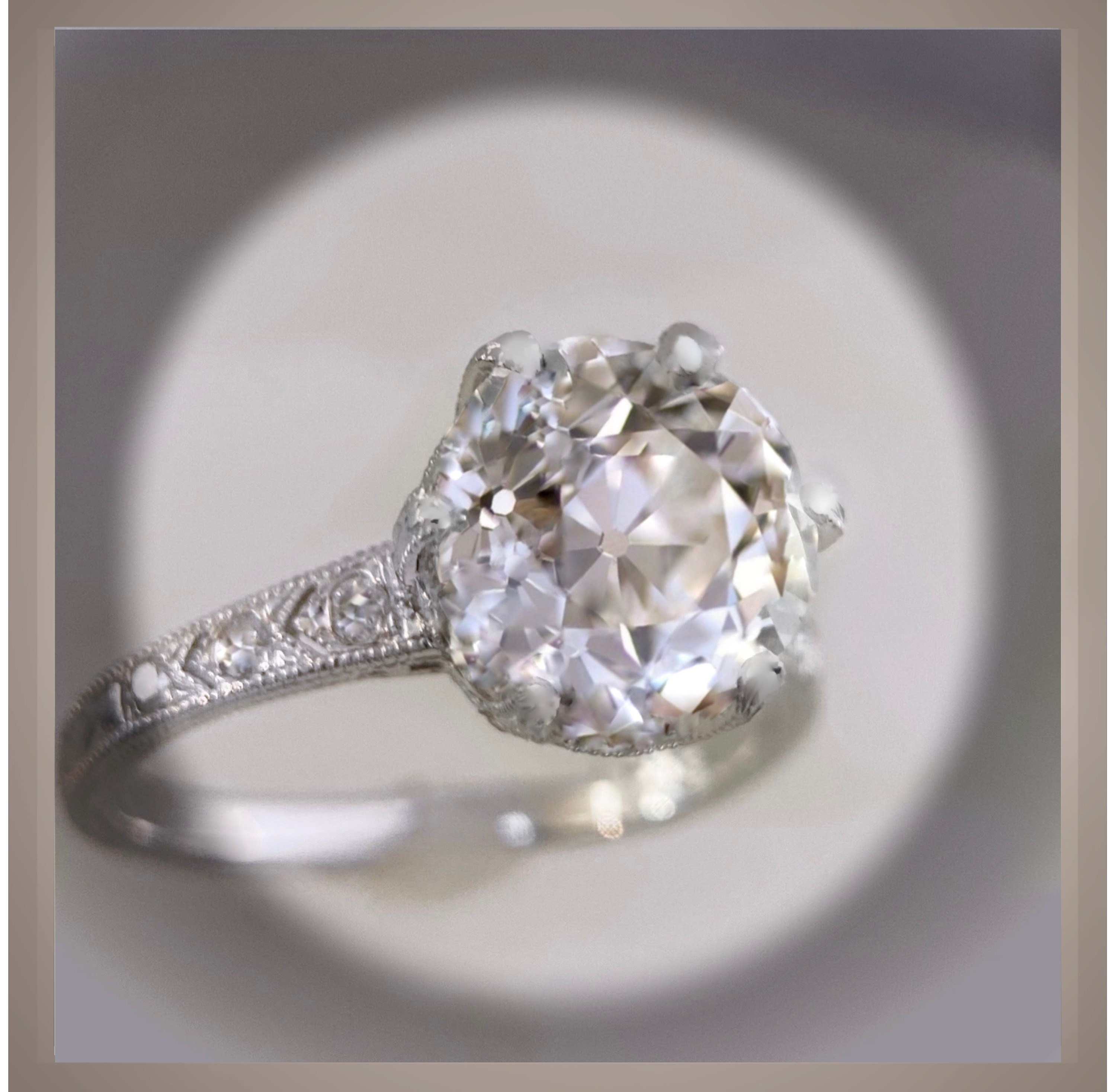 Antique-inspired cushion-shaped diamond engagement ring