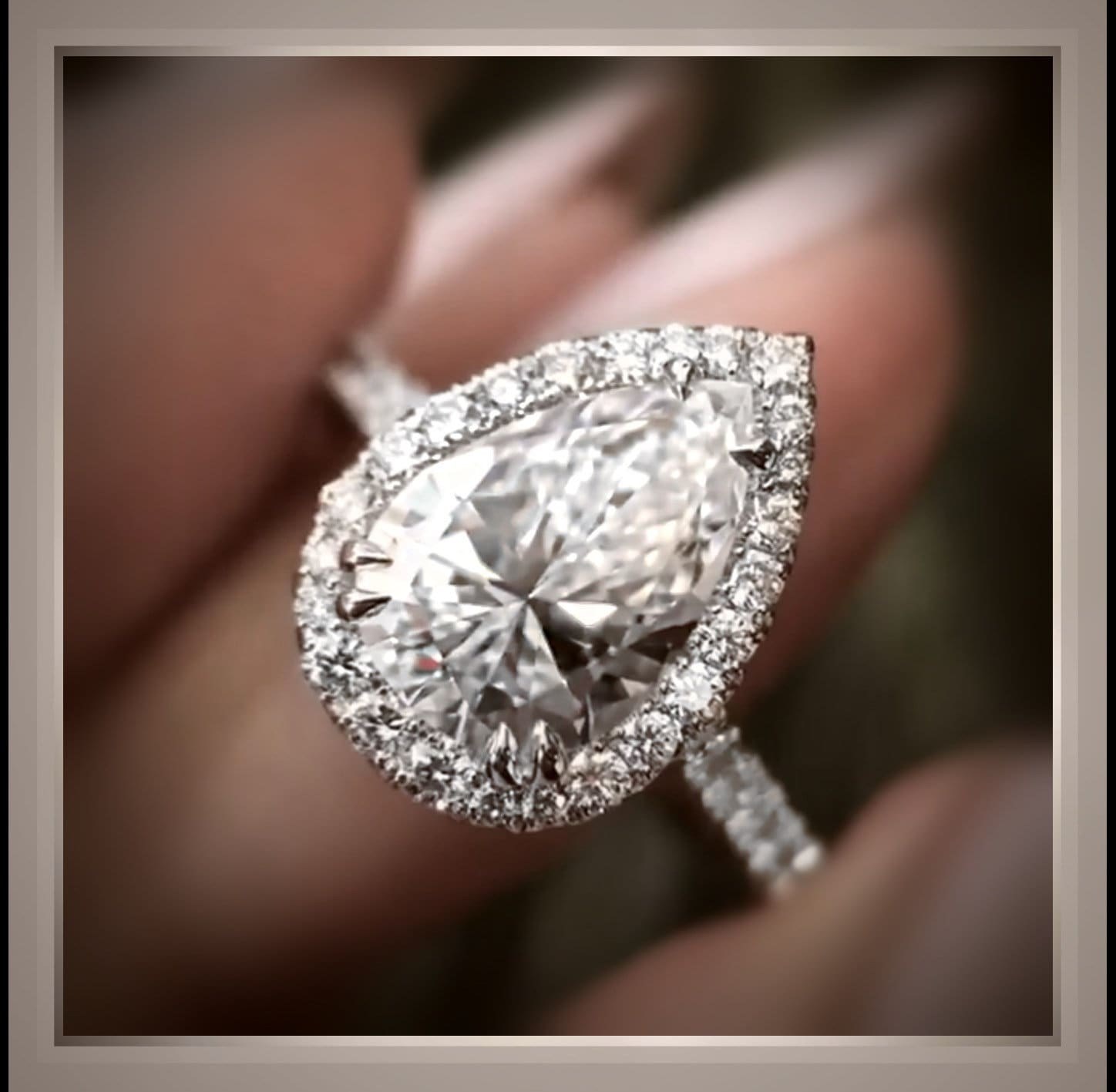 Detailed view of an antique-inspired diamond ring with decorative shoulders
