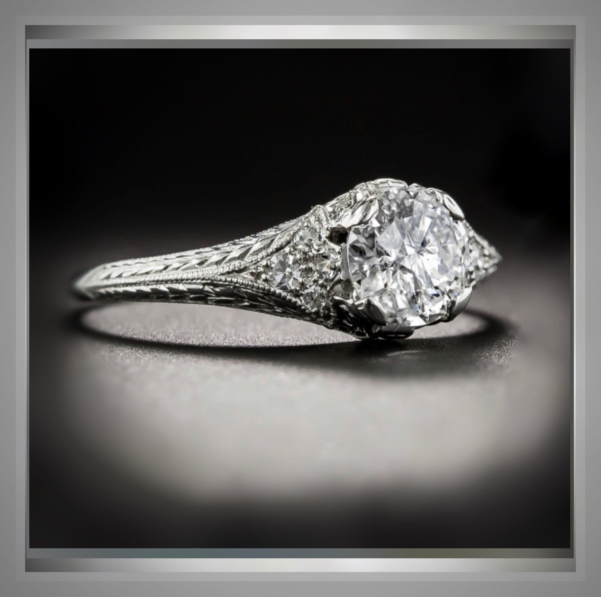Antique-inspired diamond solitaire showing a detailed side profile and shoulders