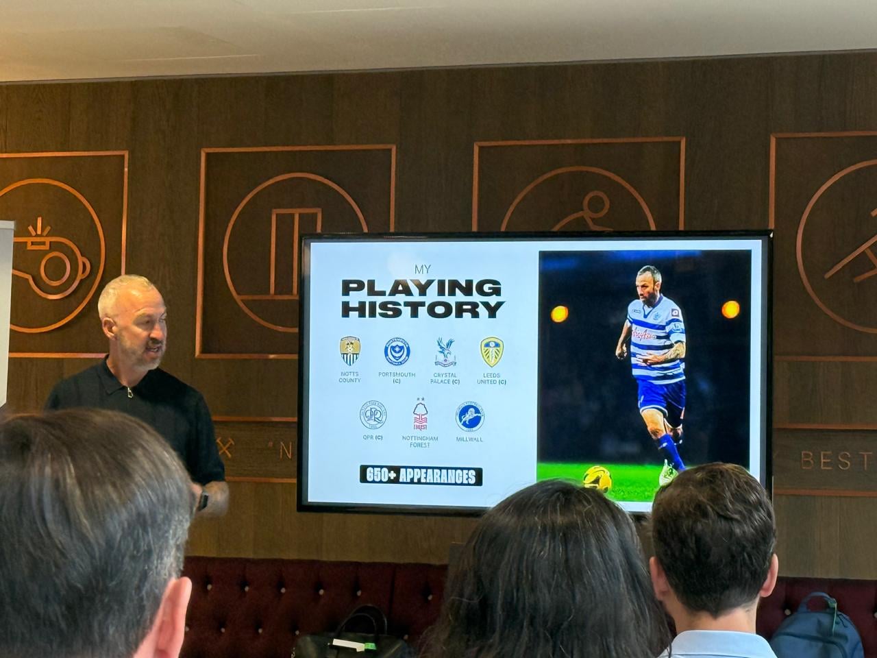 A former football player sharing his experience with business guests