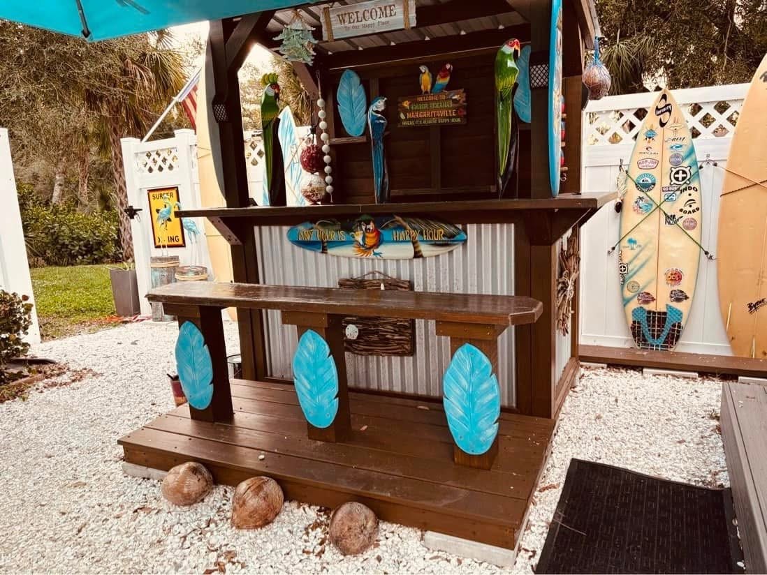 Beach-inspired backyard bar with surfboard details